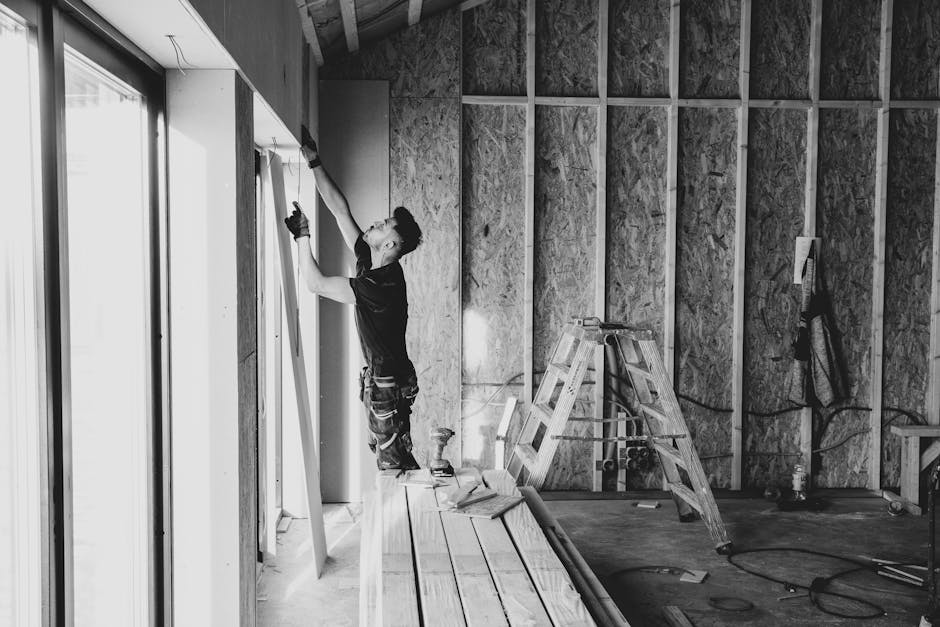 Professional contractor carefully installing a replacement window